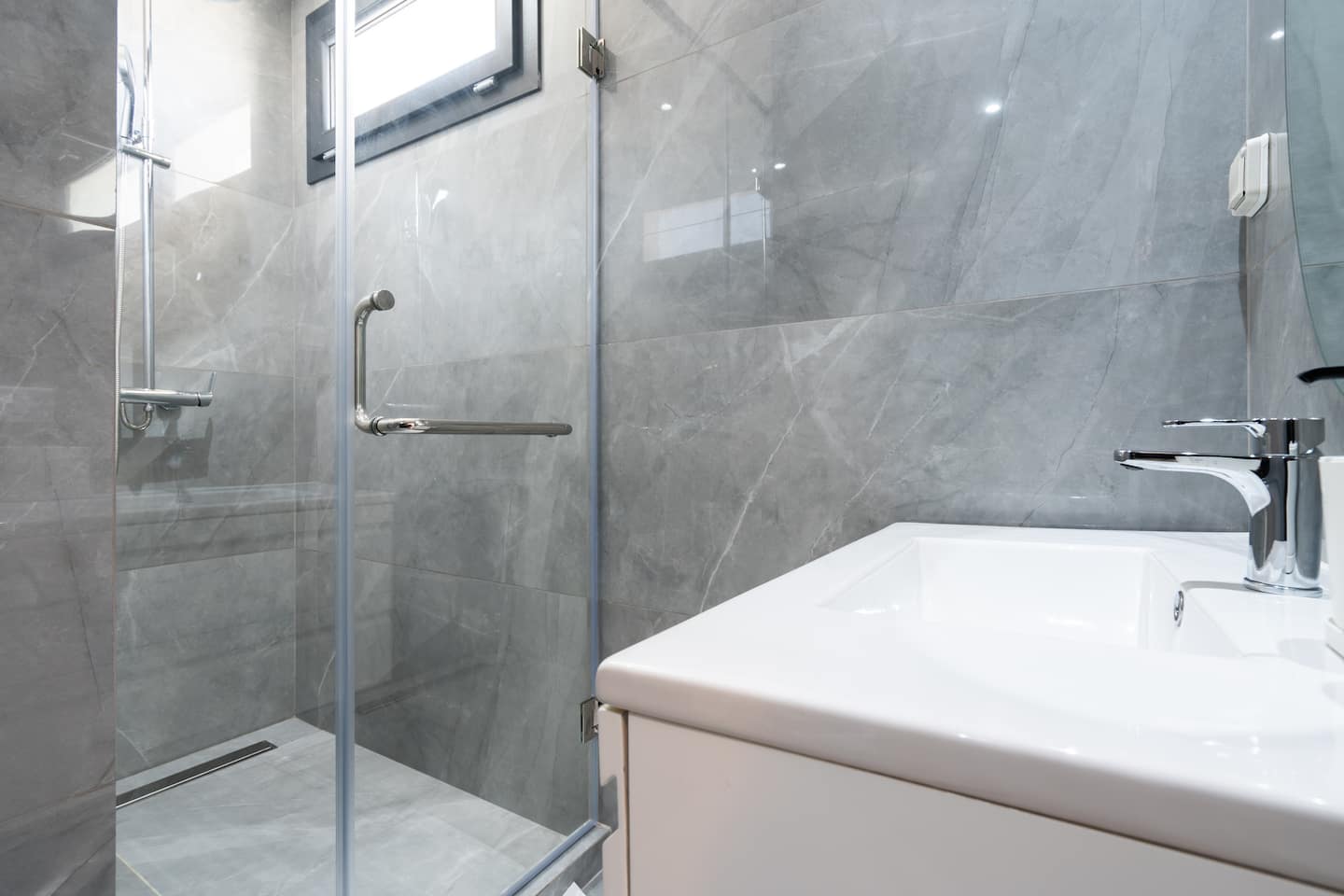 Spa-style bathrooms in grey marble